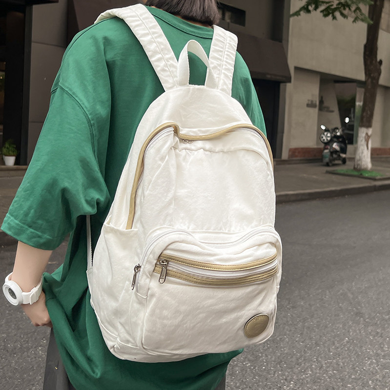 书包女大学生韩版inps慵懒风简约古著感少女帆布双肩包高中生揹包