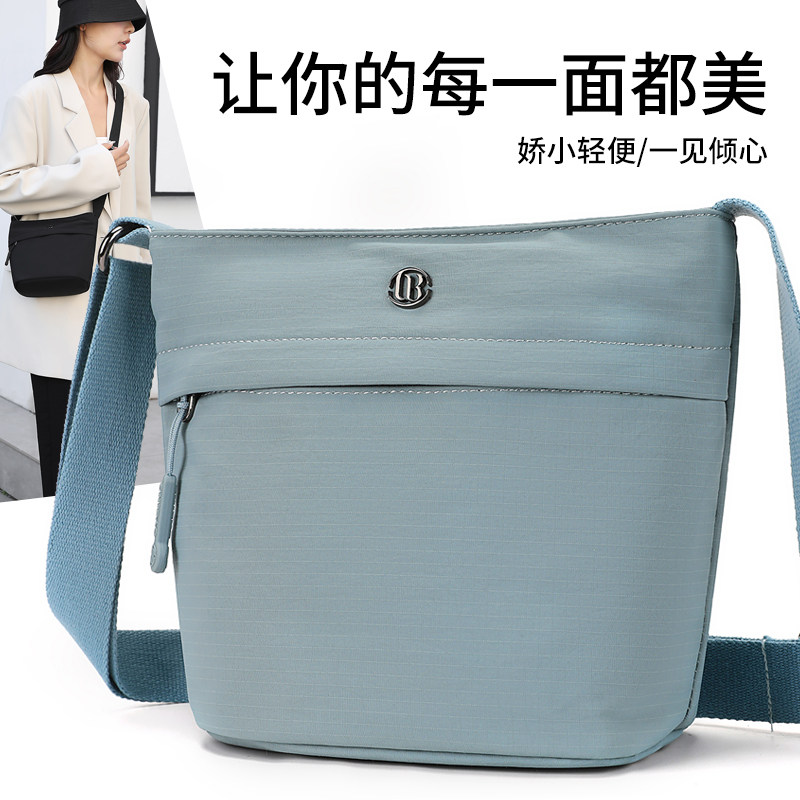 帆布水桶包包女士大容量单肩包2024新款休闲包通勤斜挎轻便糖果色