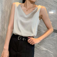 A plus-size, chubby girl wears a women's satin suit with a halter top. The loose base layer makes her look slimmer and covers her belly. She wears a sleeveless top on the outside thumbnail 5