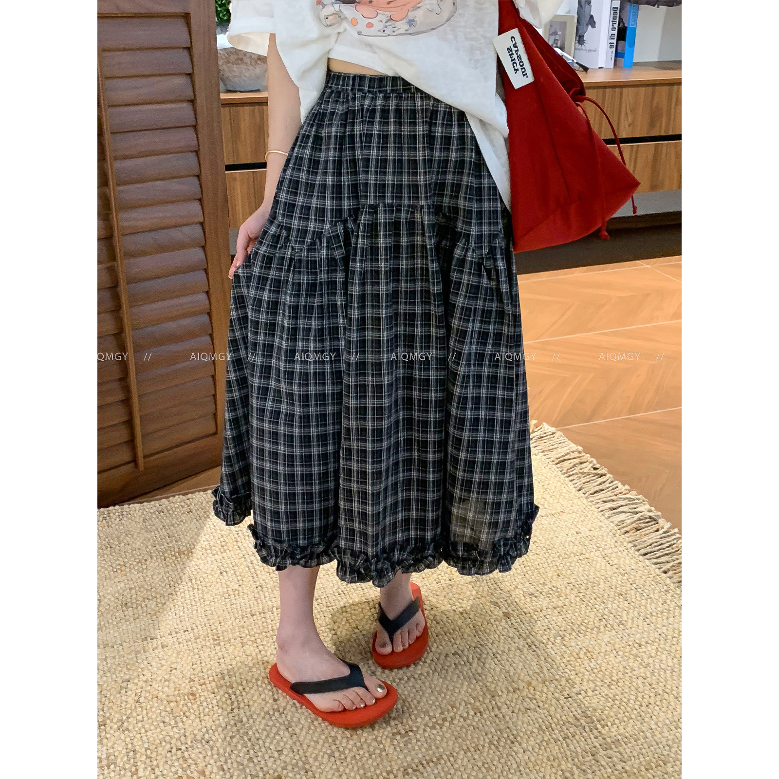 爱情魔鬼鱼 木耳边格子半身裙女2026夏季新款高腰通勤宽松A字长裙