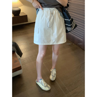 爱情魔鬼鱼 纯色松紧腰抽绳工装半身裙女2026夏季新款宽松A字短裙