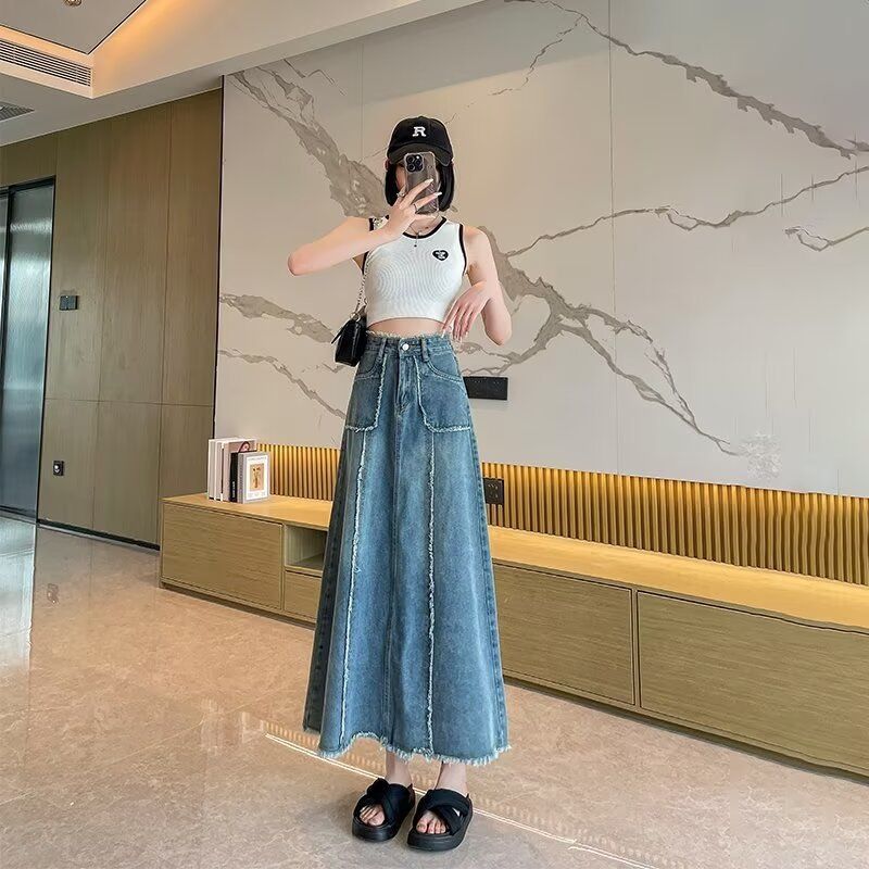 港风牛仔半身裙女复古毛边拼接设计感a字遮肚子显瘦包臀中长裙子图片