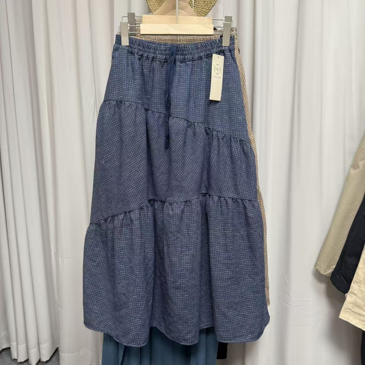 精品日单秋季新款s棉麻混纺复古森系蛋糕裙A字口袋抽绳格子半身裙