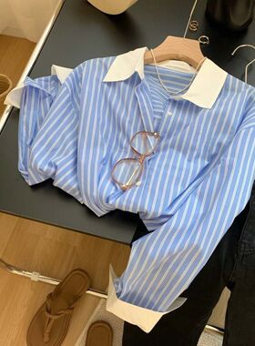 2023年早春新款气质小众设计感蓝白拼色条纹百搭衬衫长袖上衣女潮