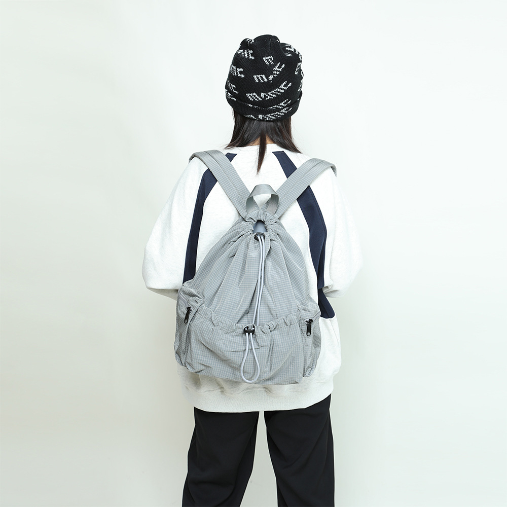 2025春季新款尼龙布格纹休闲双肩包小背包女轻便韩系ins抽绳书包