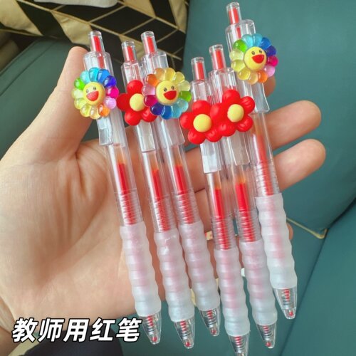 教师用小红花红笔节日送老师礼物