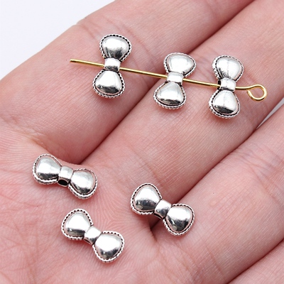 40个/包 12x6mm 古银色锌合金材质 蝴蝶结小孔珠 ABD-C16532