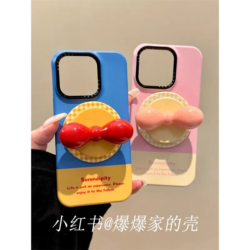 适用苹果iphone16promax拼色蝴蝶结15pro磁吸14支架13ins风手机壳 · 粉黄单支架 iphone15pro