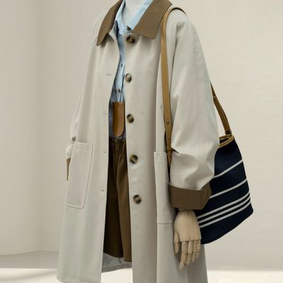 日系卡其风衣秋2025新款女装巴恩松弛感显瘦撞色翻领中长外套