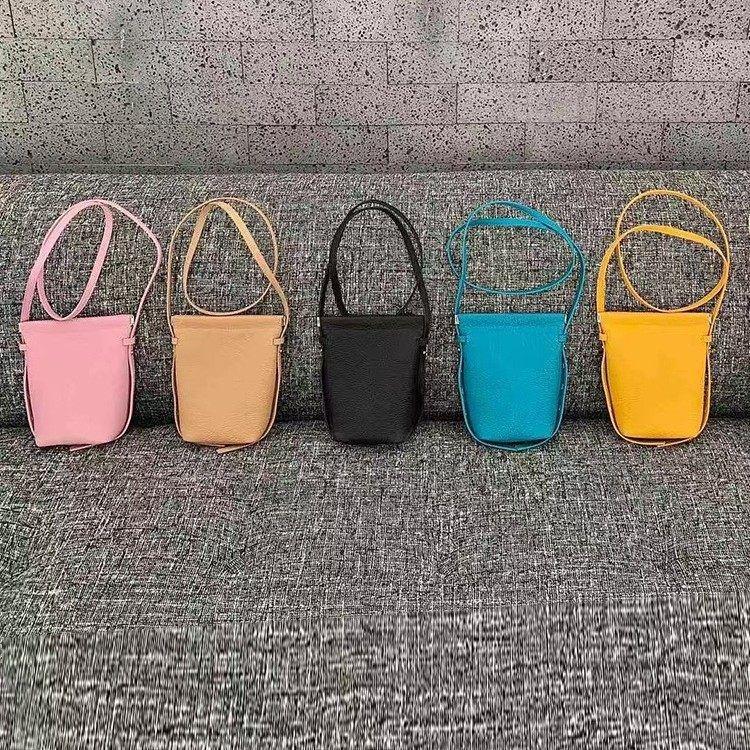 糖果色真皮手机包女2025春夏新款togo牛皮韩版小包休闲斜挎水桶包