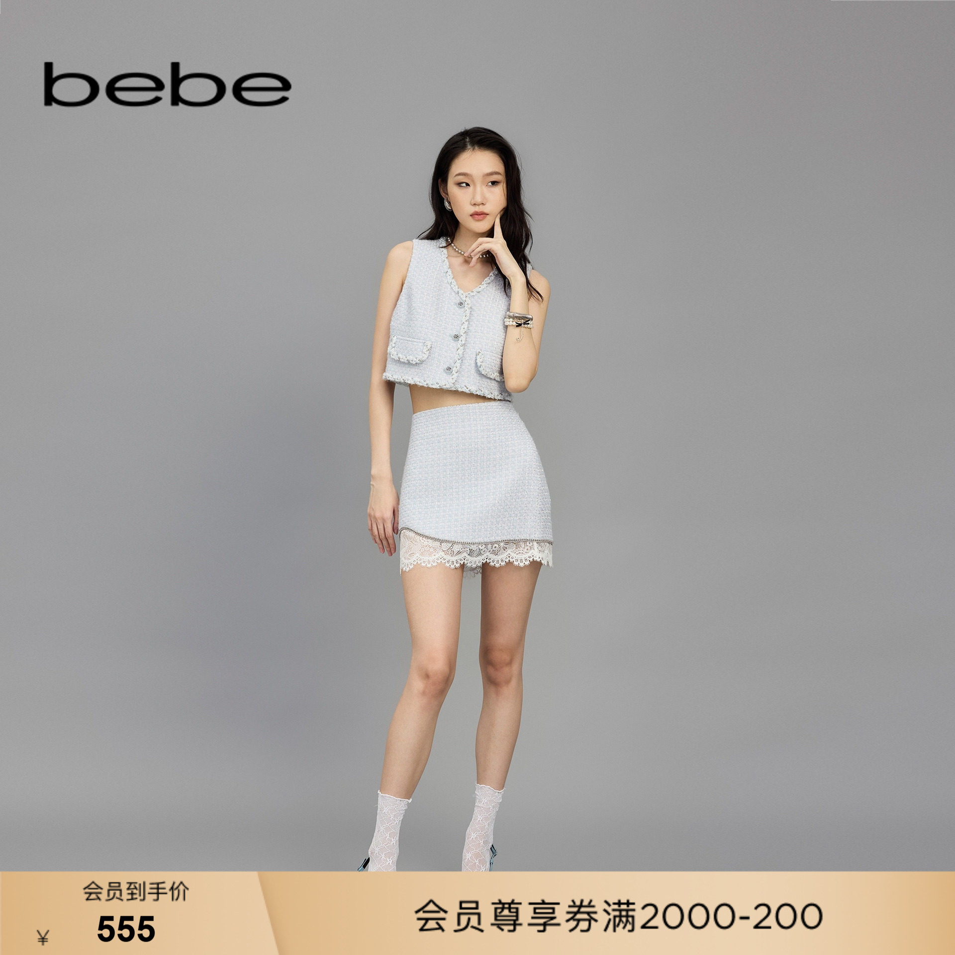 bebe春季新款钻链缀饰半身裙图片
