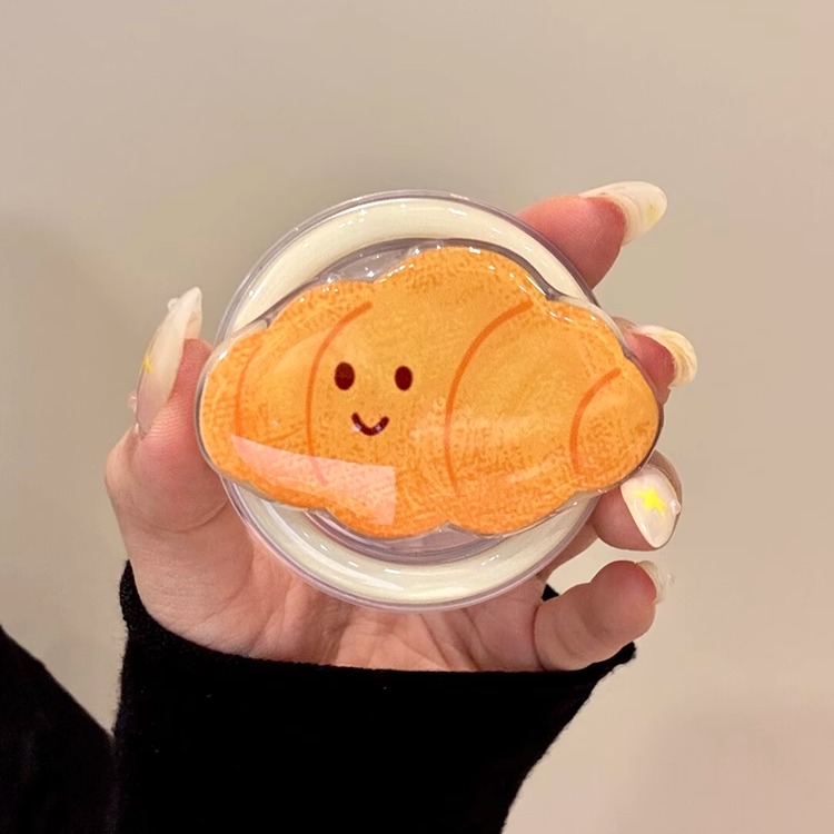 可爱笑脸表情可颂磁吸支架适用MagSafe手机强力吸附桌面懒人支架