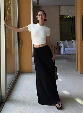 NEVAHU黑色半身裙女长款2025春夏新款设计感修身显高显瘦A字半裙