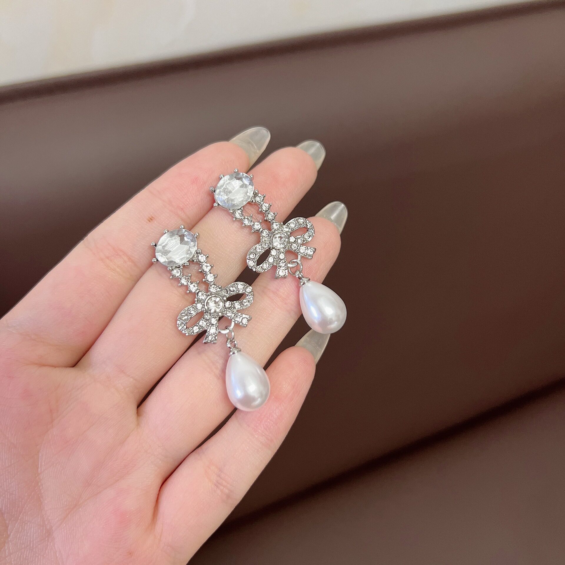 撤柜韩式精美镶钻蝴蝶结水滴珍珠耳环超闪优雅个性冷淡风网红爆款