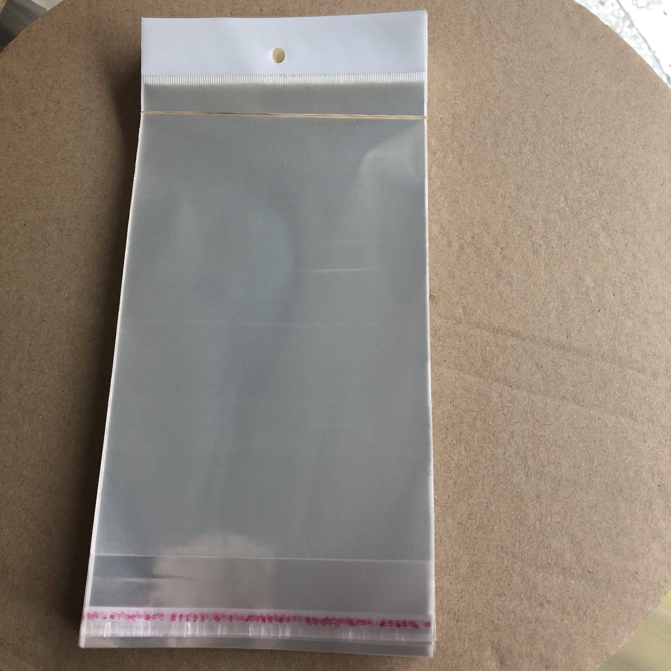 7丝10×26opp不干胶自粘袋透明袋白色卡头袋项链袋100个挂孔