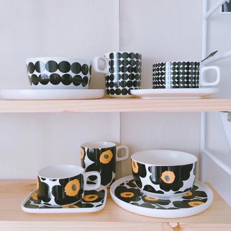 A coffee cup with black and white classic ceramics