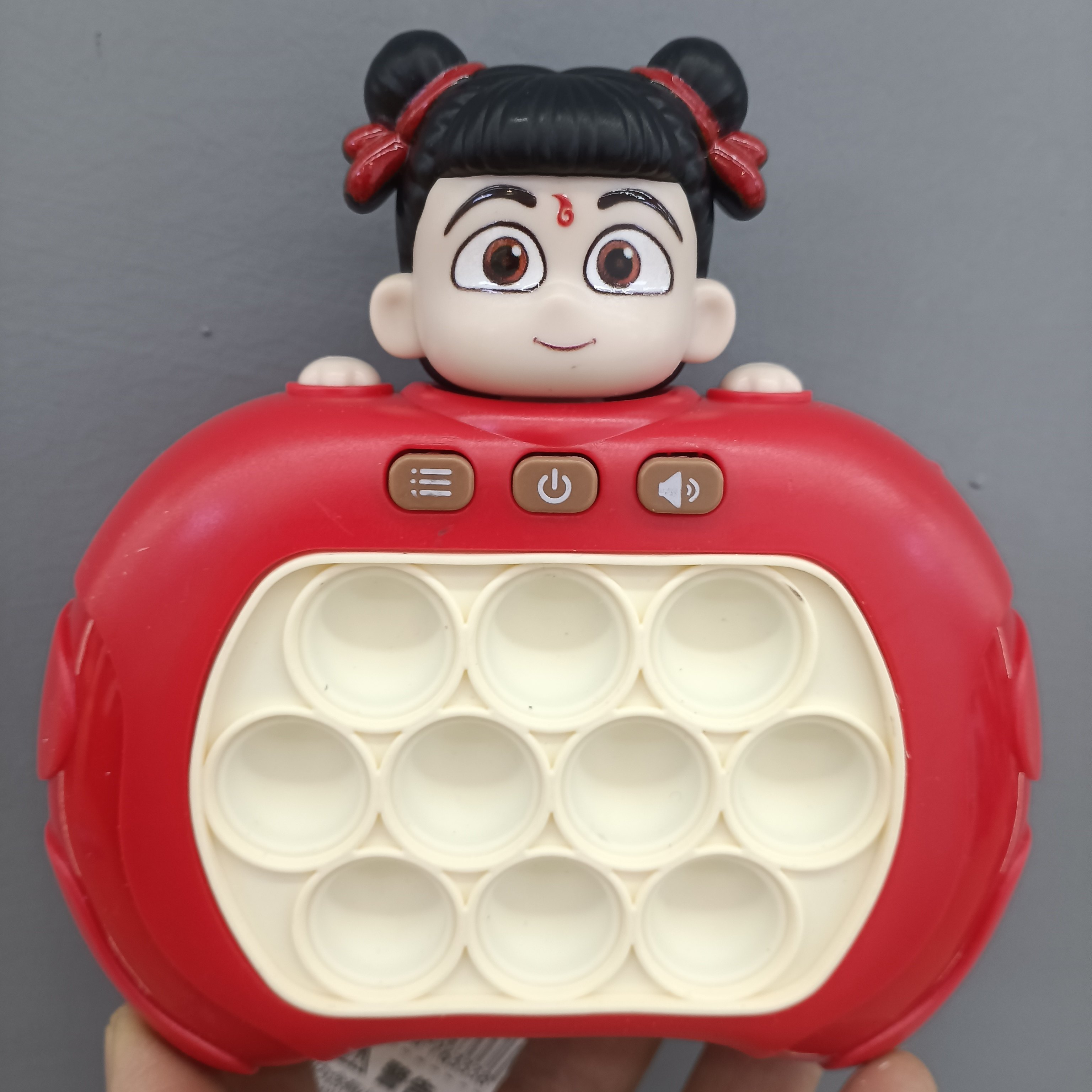 哪吒速推游戏机解压玩具按按乐