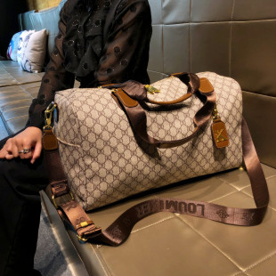 香港品牌短途旅行包2026新款大容量便携手提包真皮时尚行李袋男女