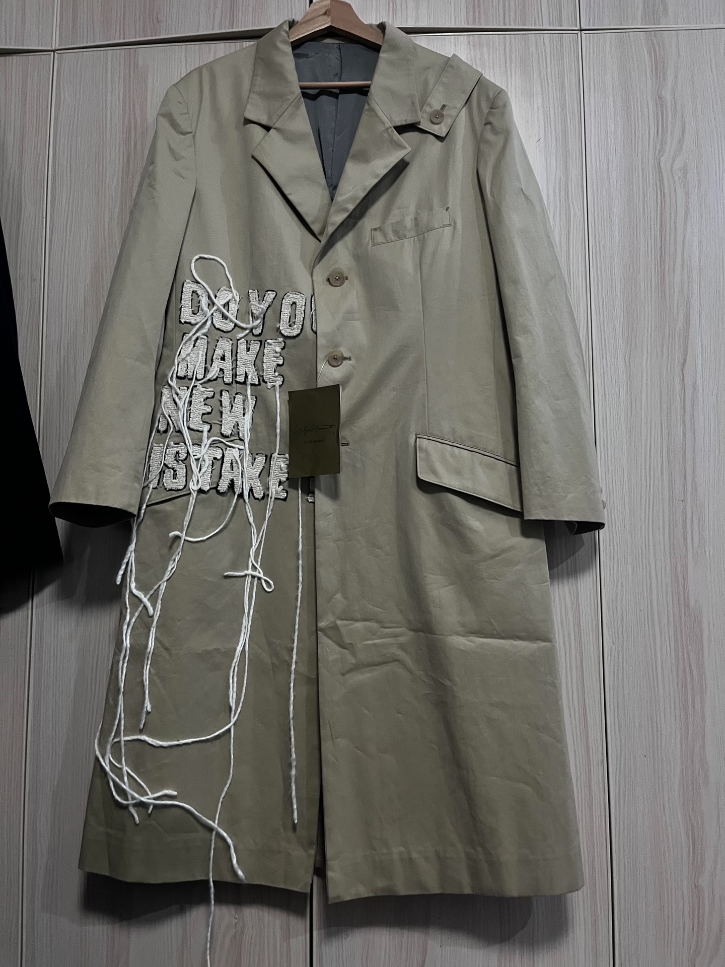 Yohji Yamamoto Beige Slogan Fringe Coat — front