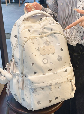 大容量印花星星书包初中女四五六年级减负背包透气宽肩带双肩包女