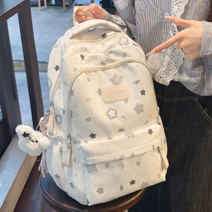大容量印花星星书包初中女四五六年级减负背包透气宽肩带双肩包女