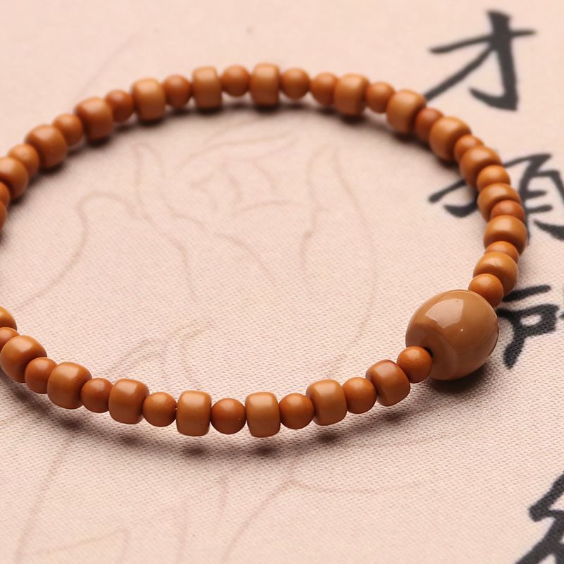 原创设计橄榄核手链核尖雕刻隔珠圆柱老型桶珠核桃手串单圈文玩男