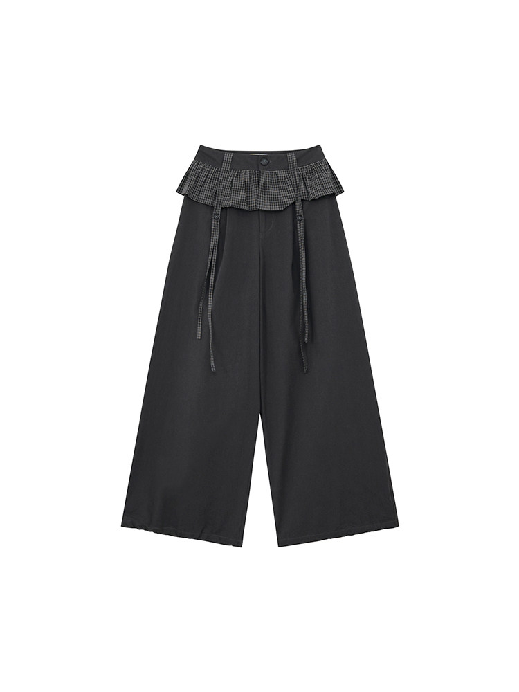 Black wide-leg pants with a plaid ruffle waistband on a white background