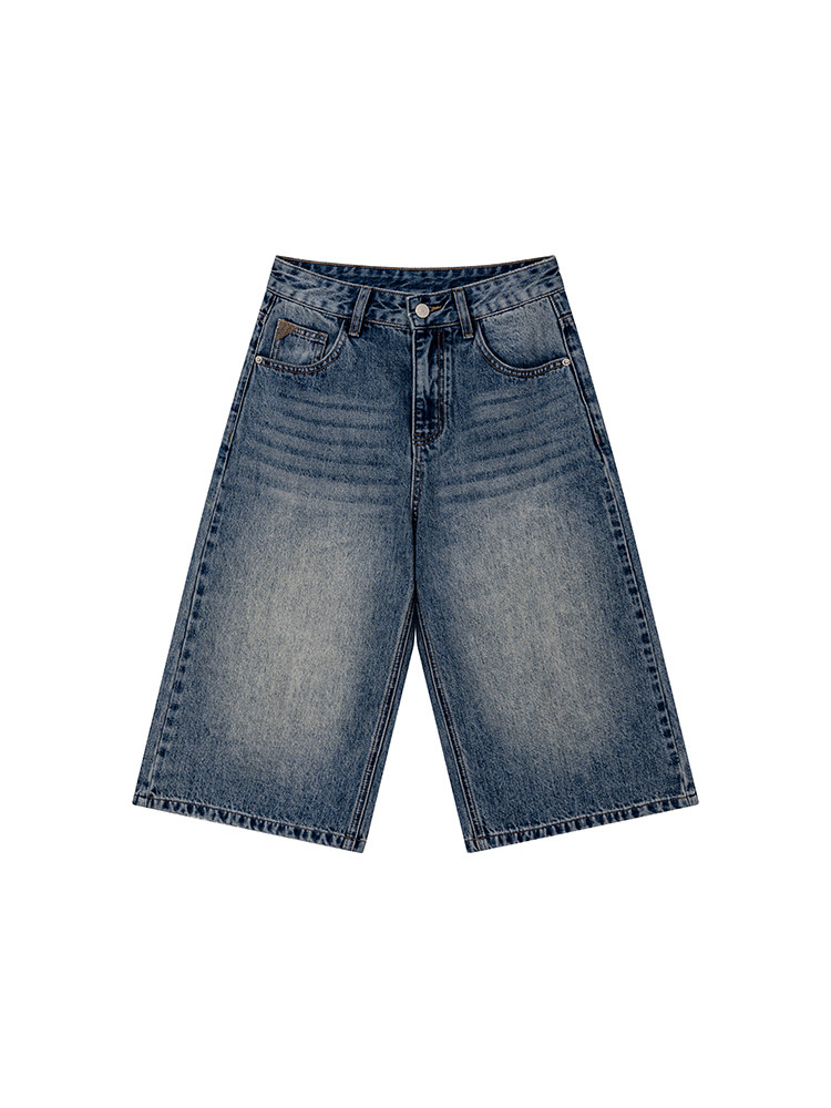 Blue denim knee-length shorts laid flat on a white background