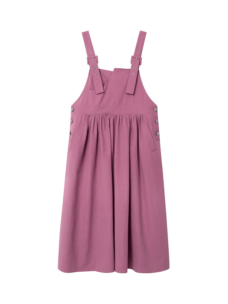 Pink sleeveless pinafore dress laid flat on a white background