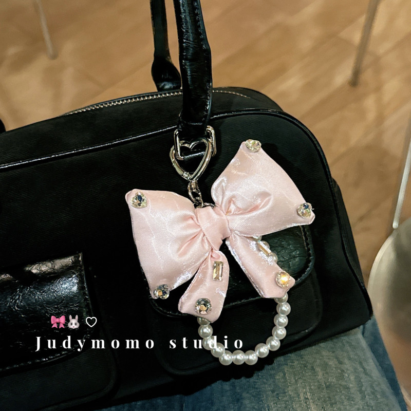 韩系miu风气质闪钻蝴蝶结粉少女珍珠链包挂新款手机链包挂件小众