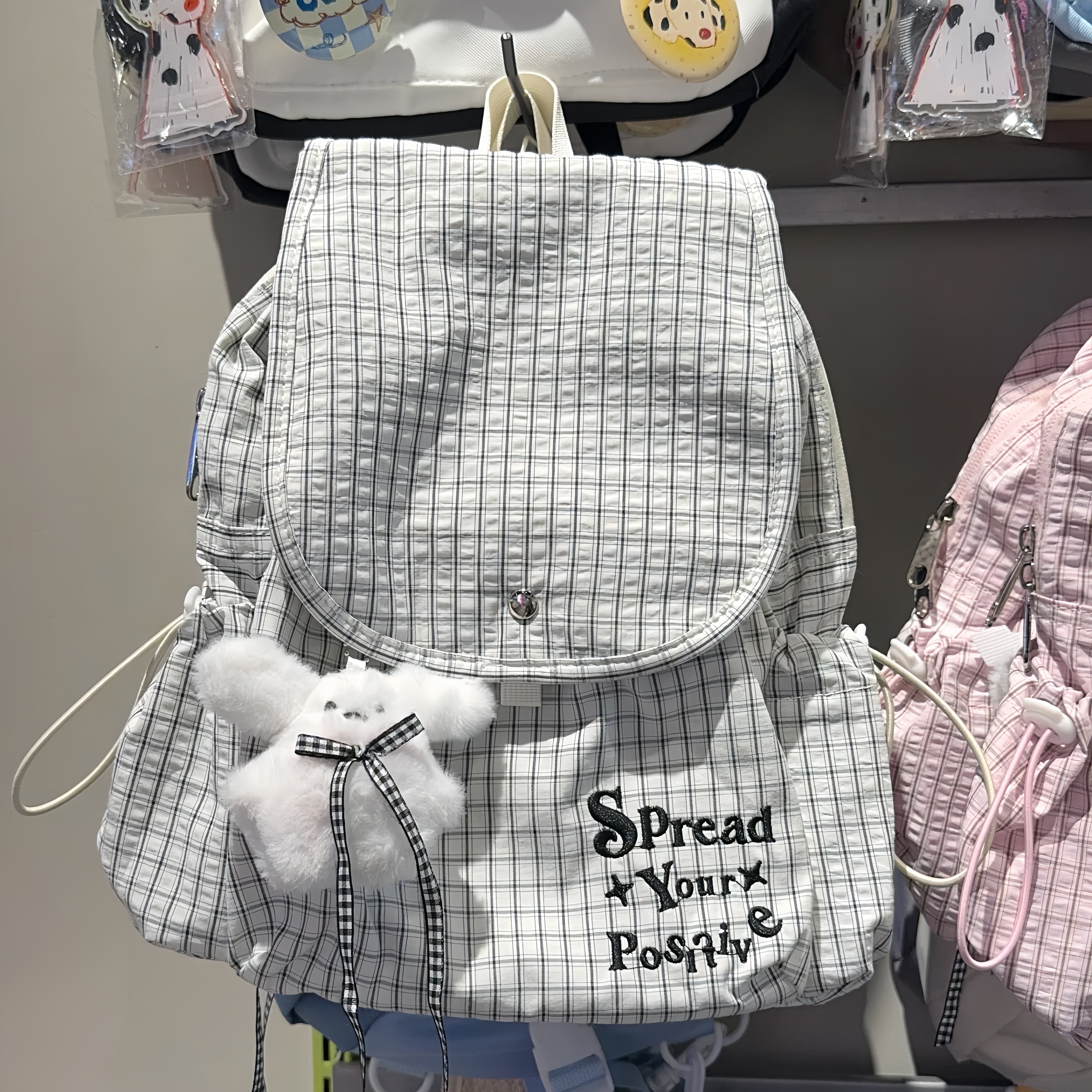 韩版休闲学院风双肩背包女潮百搭大容量格子帆布包休闲水桶包
