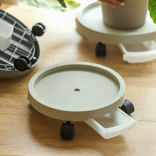 Принесите лоток с тормозным цветочным горшками, чтобы подключиться к подносу с водным подносом, чтобы перемещать пластиковые густого семянного зеленого основания с колесами