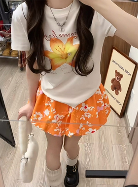 田园风热情橘花南瓜花苞短裙2025夏季新款a字小众设计橘色半身裙