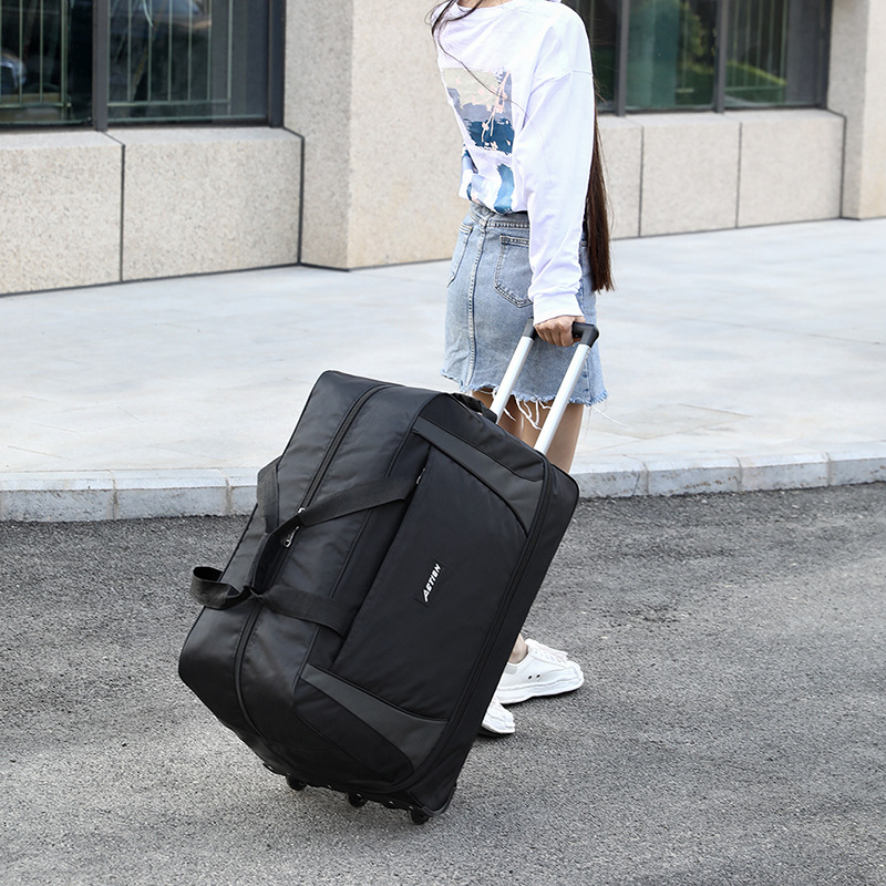 手提拉杆两用包2025新款旅行手提牛津布大容量带轮收纳折叠行李袋