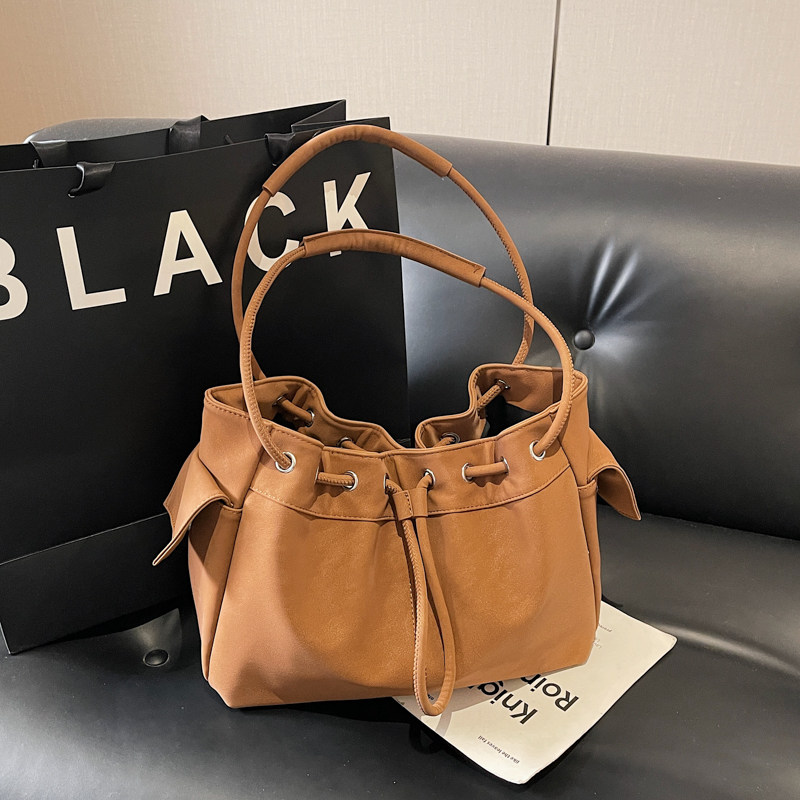 美拉德废土风简约水桶包女高级感束口抽绳单肩包大容量通勤托特包,箱包皮具/热销女包/男包,水桶包,淘宝优惠券,粉丝福利购,淘宝优惠卷