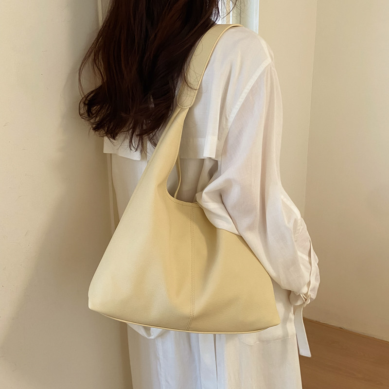 慵懒松弛感黄色单肩包包女士2026新款大容量休闲腋下包通勤托特包