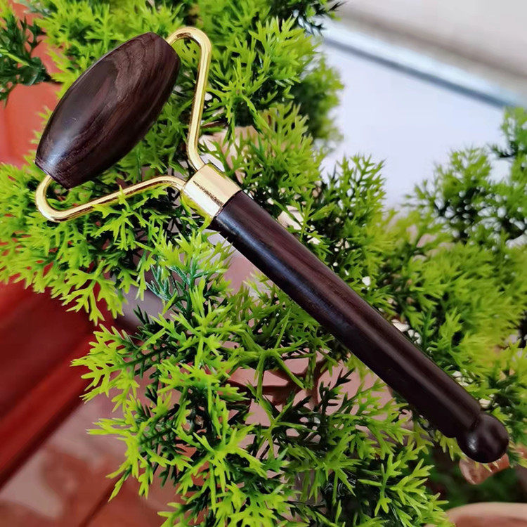 厂家直供紫光檀木滚轮按器乌木脸部面部按滚轮刮痧板按轮