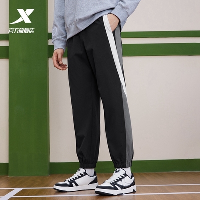 特步撞色运动裤男2025秋季新款篮球休闲束脚梭织长裤976129980534