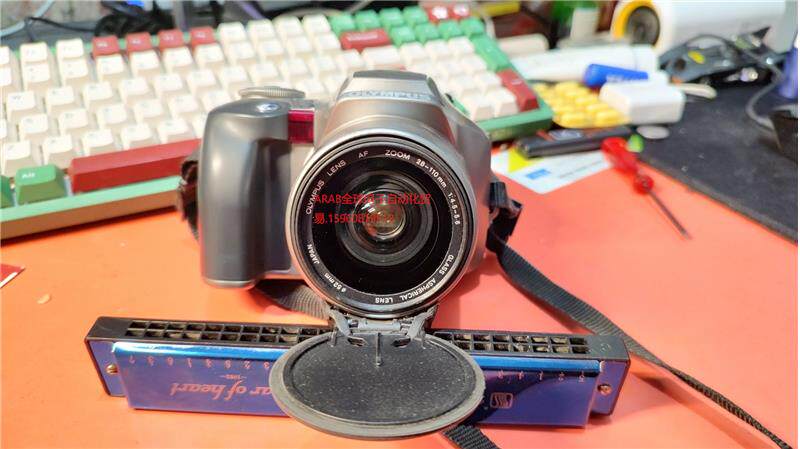 奥林巴斯is-300长焦胶卷相机,成色还行,没有这个小电池测
