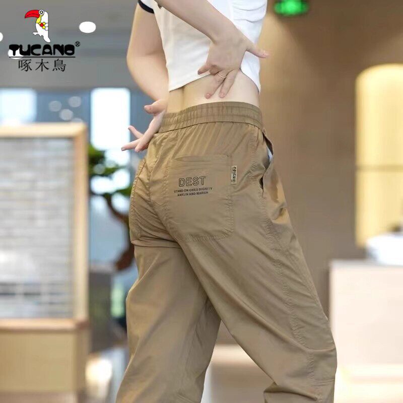 啄木鸟工装冰丝休闲裤子男宽松束脚哈伦运动新款夏季薄款九分裤