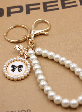 蝴蝶结珍珠手串包包钥匙扣 女士可爱高档钱包滴油蝴蝶结吊牌挂件