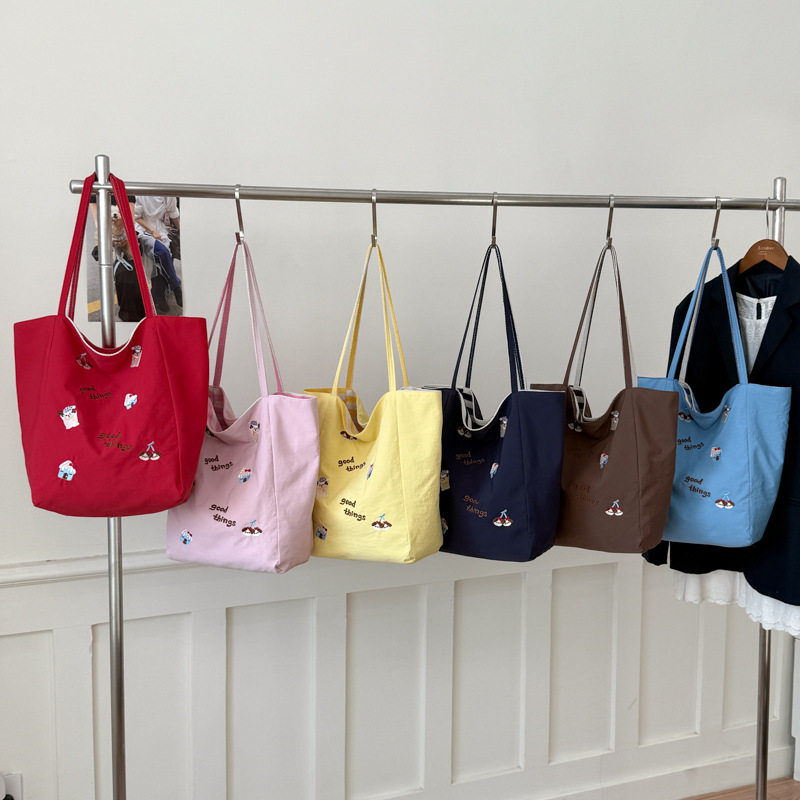 可爱卡通刺绣帆布包女大容量手提单肩包日韩风通勤上课休闲布包