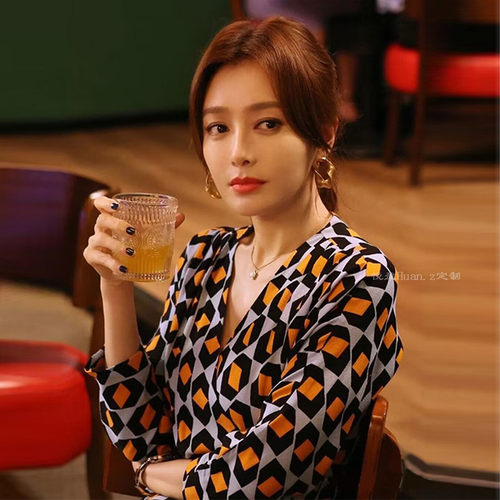 芳心荡漾同款橘色印花系带连衣裙