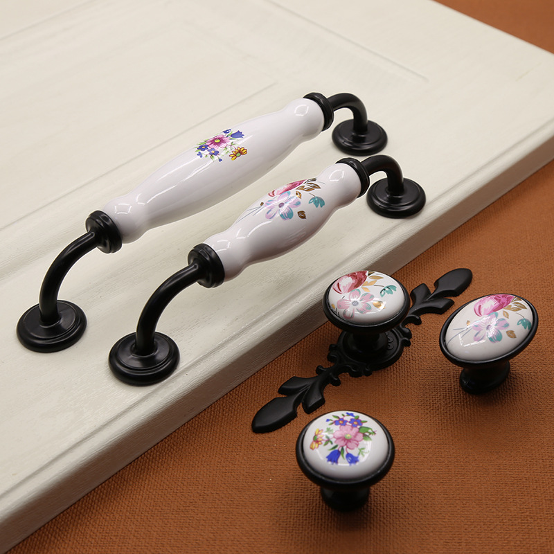 .式黑色锌合金陶瓷拉手现代兰花单孔田园欧式橱柜门把手工厂直销