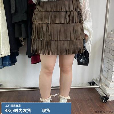 十三行2025秋季服装游牧风格高腰修身看臀部棕色流苏不对称裙子的