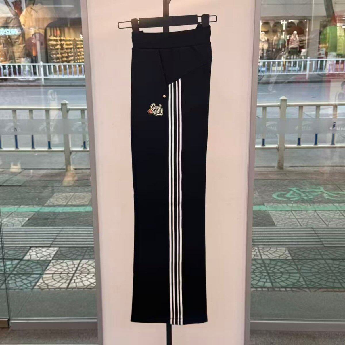 安踏好事发生丨新年鸿运休闲卫裤女士针织长裤微喇裤子162618302