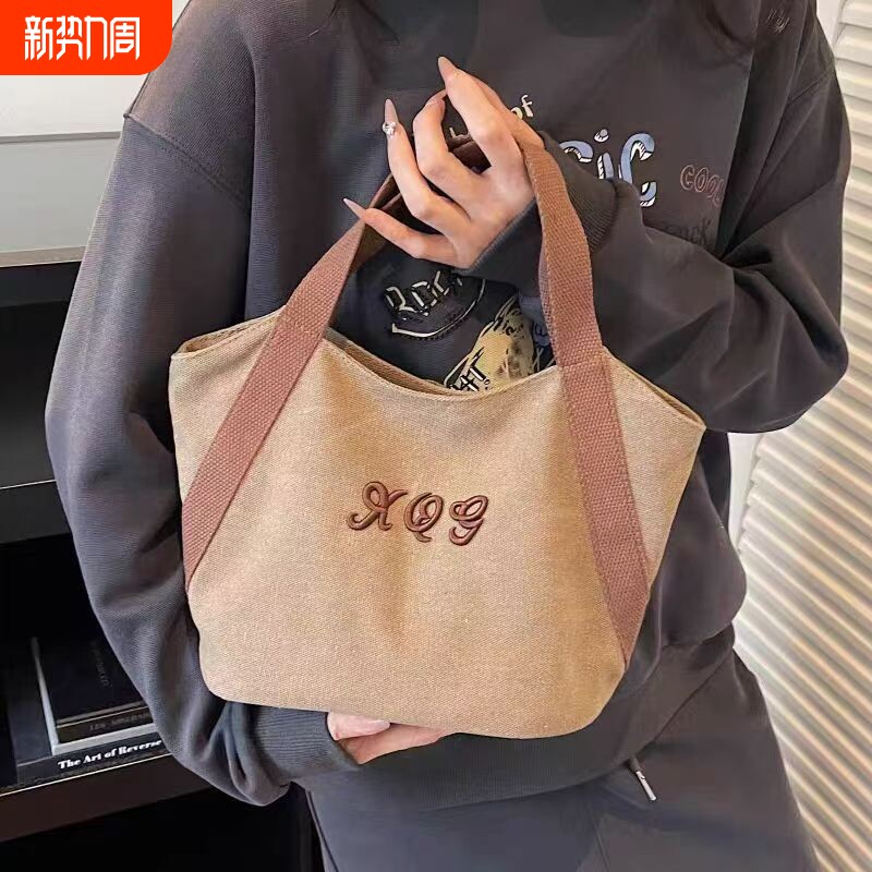 帆布包上班托特拎女包2025新款简约通勤饭盒便当手提包手提小布包