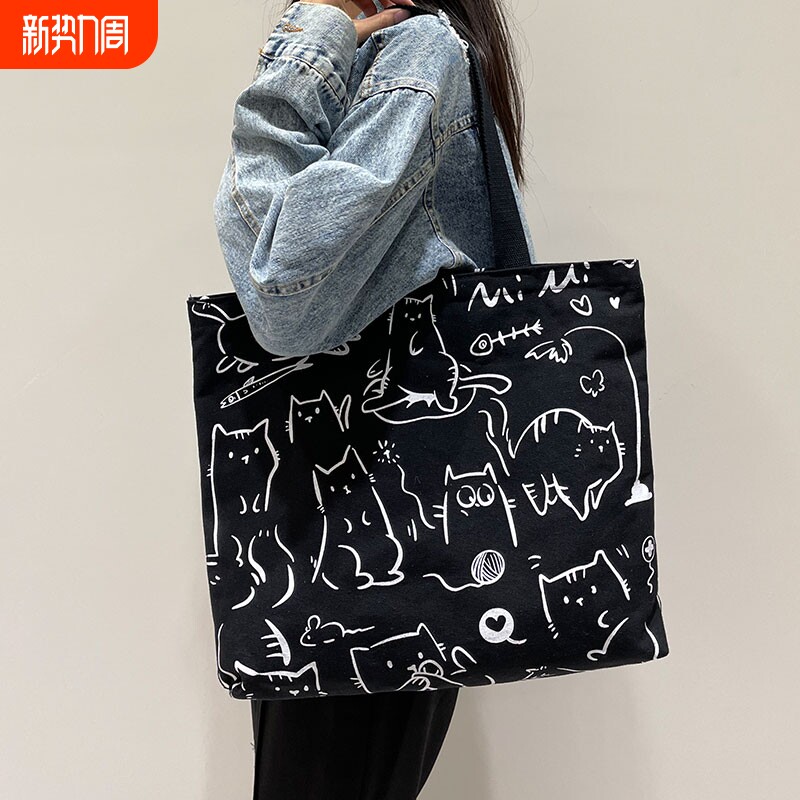 帆布包女2024年大容量通勤手提袋学生单肩包上班挎包黑色时尚可爱