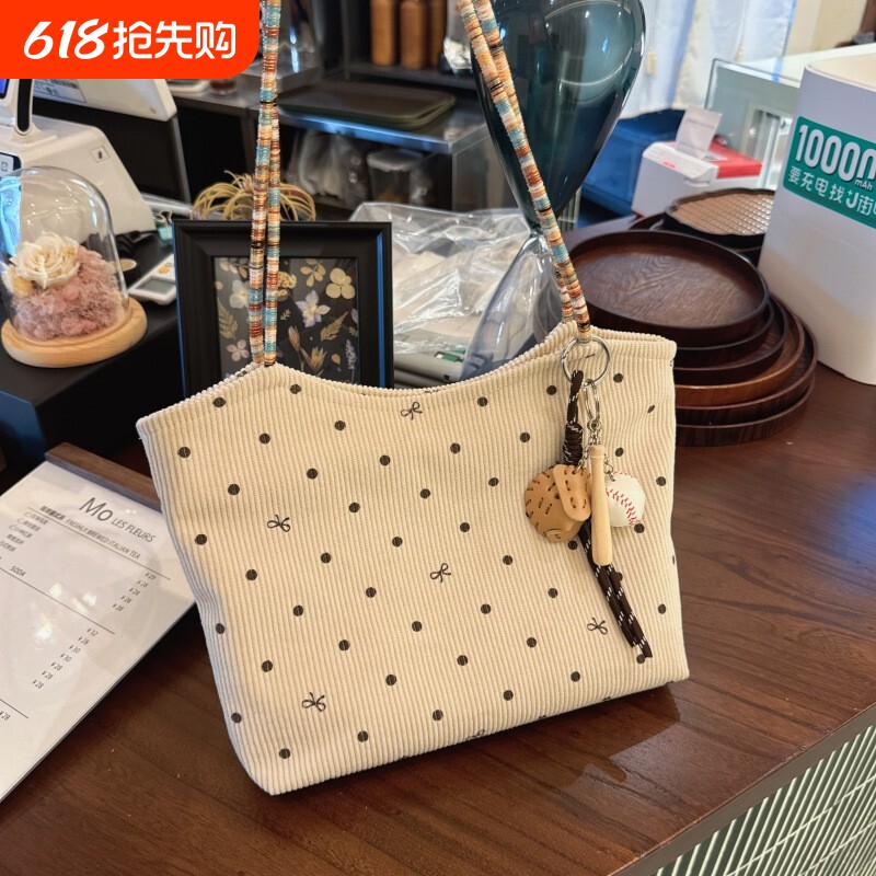 新款韩系灯芯绒单肩包女美拉德小众设计波点蝴蝶结腋下通勤托特包