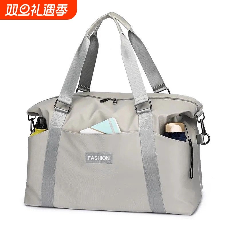 大容量手提短途旅行包女时尚轻便防水行李包男出差旅游收纳登机包